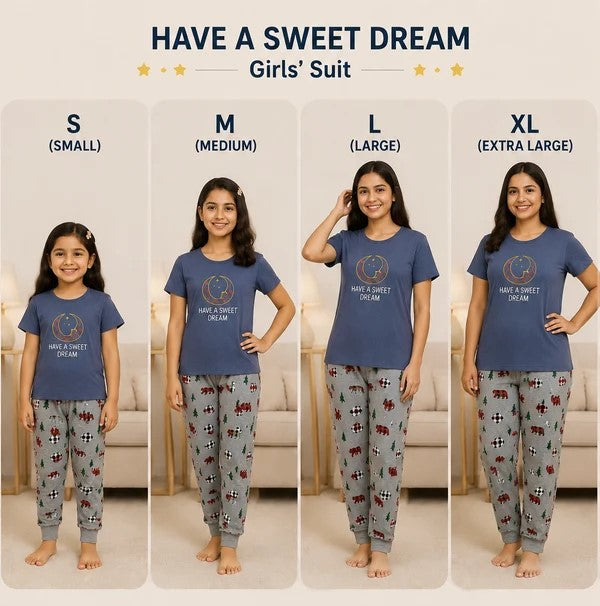 A size chart for a girls' sleepwear set showing four models wearing the same blue t-shirt and patterned pajama pants in sizes S, M, L, and XL. The top of the image has the text 'HAVE A SWEET DREAM Girls' Suit' with size labels underneath each model.