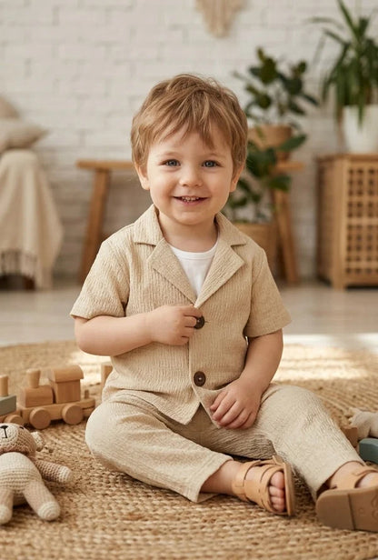 beige short-sleeve button-up shirt and matching trousers, 